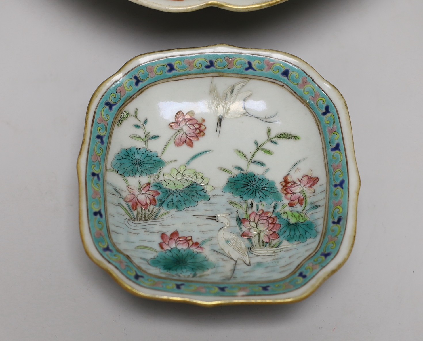 A set of Chinese famille rose bird or insect and flowers dishes, Tongzhi mark and period (1862-74), largest 23 cm wide